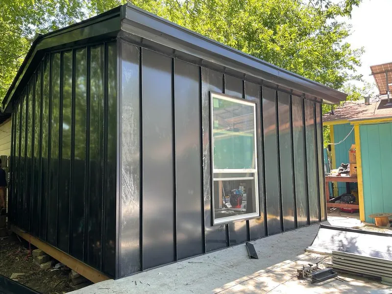 Black standing seam metal wall panels for Metal Roof Installation in Winfield